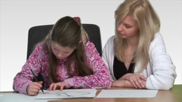 Mother heling her child with homework — Stock Video