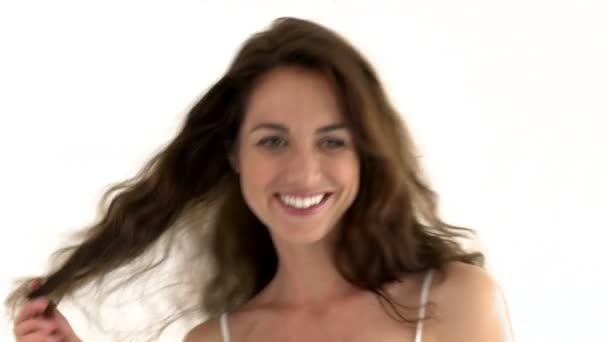 Gorgeous woman playing with the camera and touching her hair — Stock Video