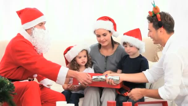 Family opening gift with Santa Claus — Stock Video