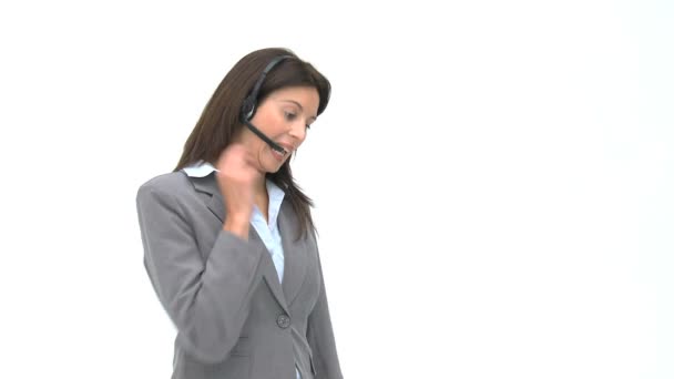 Happy businesswoman talking with headphones — Stock Video