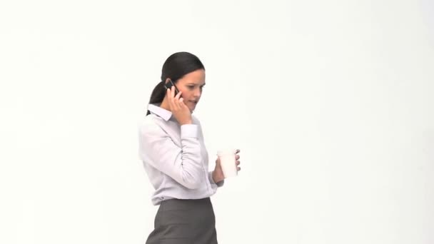 Businesswoman talking on the phone during a coffee break — Stock Video