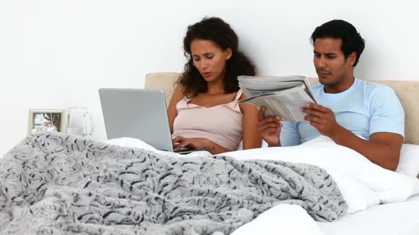 Couple relaxing on the bed — Stock Video