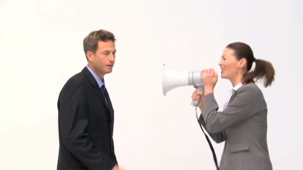 Woman shouting megaphone on a man — Stockvideo