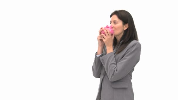 Businesswoman holding a piggy bank — Stock Video