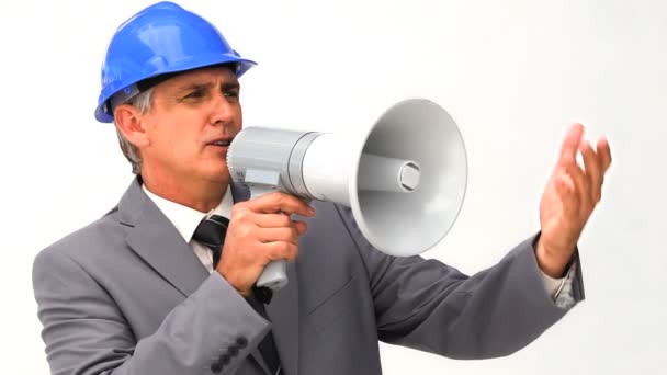 Businessman with a safety helmet and a megaphone — Stock Video