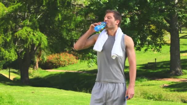 Man drinking water after sports — Stock Video