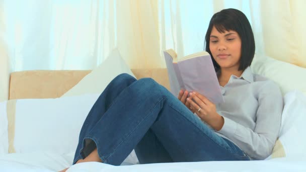 Relaxed asian woman reading a book — Stock Video