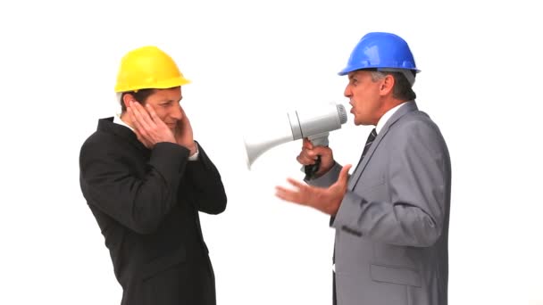 Businessman shouting through a megaphone — Stock Video