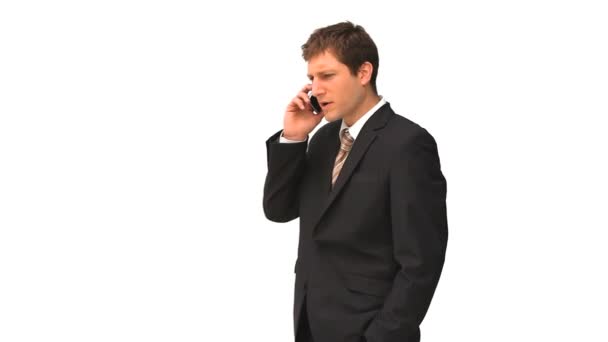 Young businessman in suit speaking on the phone — Stock Video