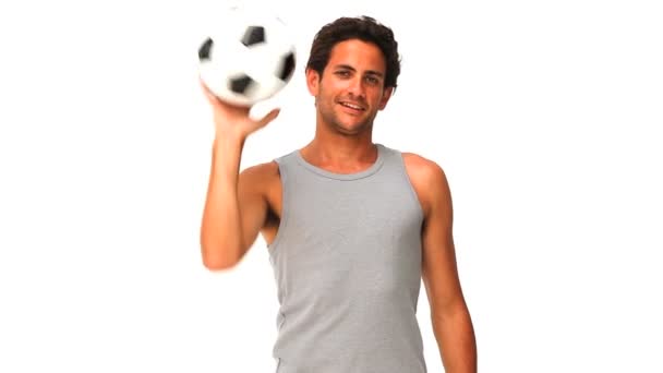 Hombre guapo con una pelota de fútbol — Vídeos de Stock