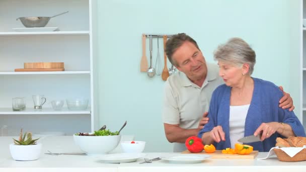 Elderly woman preparing the dinner — Stock Video