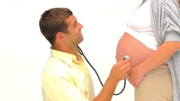 Man listening the belly of his pregnant wife — Stock Video