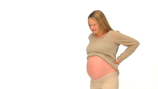 Blonde pregnant woman having a backpain — Stock Video