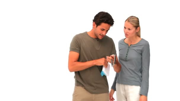 Woman offering a watch to her husband — Stock Video