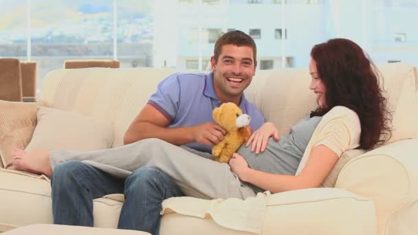 Cute couple holding a teddy bear — Stock Video