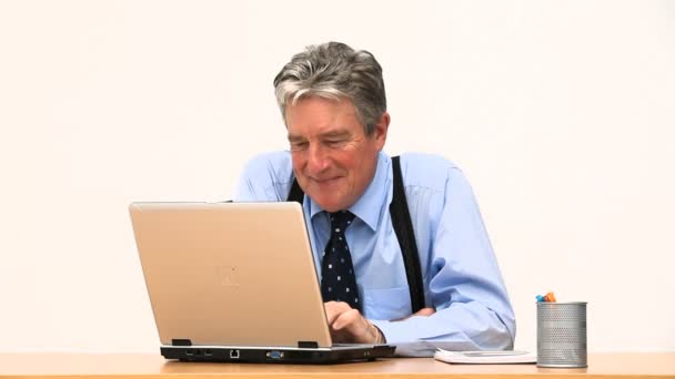 A businessman smiling in front of his laptop — Stock Video