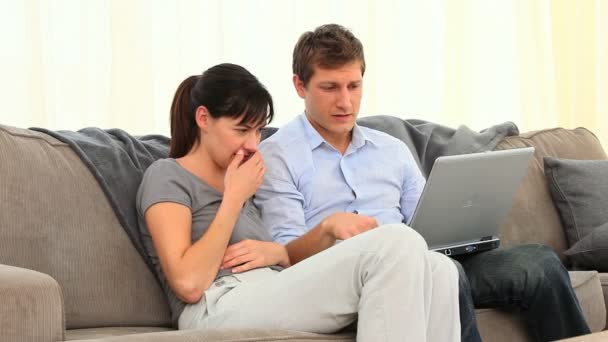 Couple are scared in front of their laptop — Stock Video