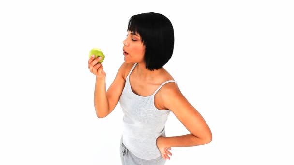 Casual asian woman enjoying an apple — Stock Video