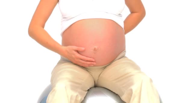 Pregnant female holding a scan of her future baby — Stock Video