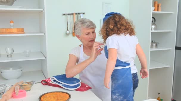 Grandmother and grand daughter after cooked — Stock Video