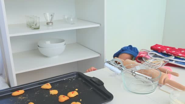 Adorable little girl stealing biscuits — Stock Video