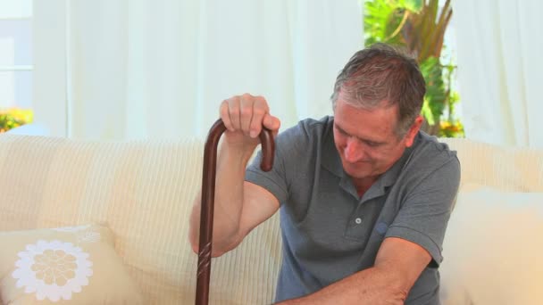 Elderly man with a walking stick — Stock Video