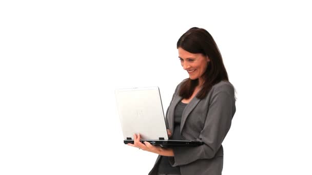 Brunette businesswoman holding with a laptop — Stock Video