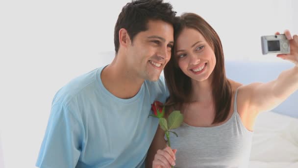 Enamored couple taking a photo of themselves — Stock Video