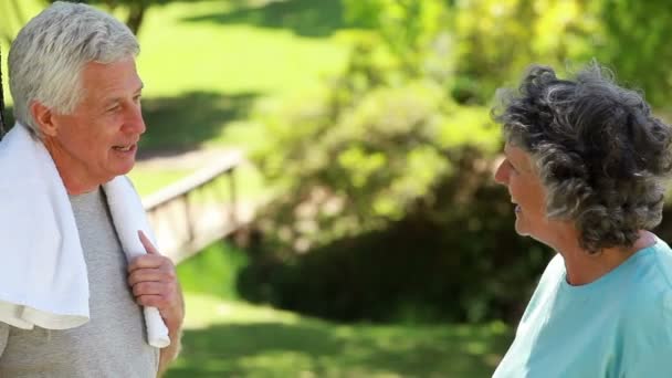 Happy couple talking together after doing exercises — Stock Video