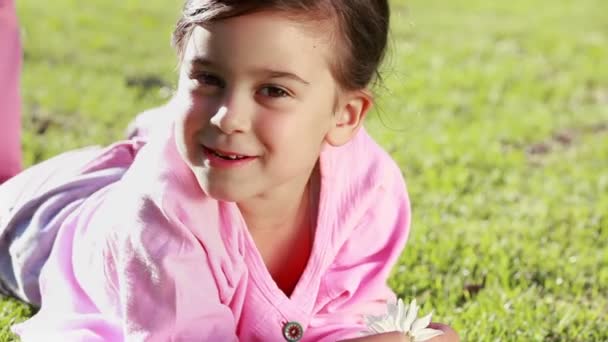 Little girl holding a beautiful flower — Stock Video