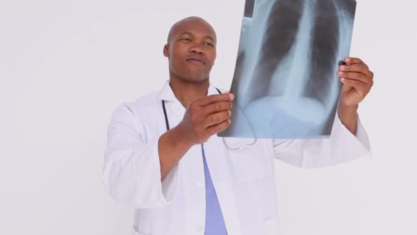 Happy practitioner holding a chest x-ray — Stock Video