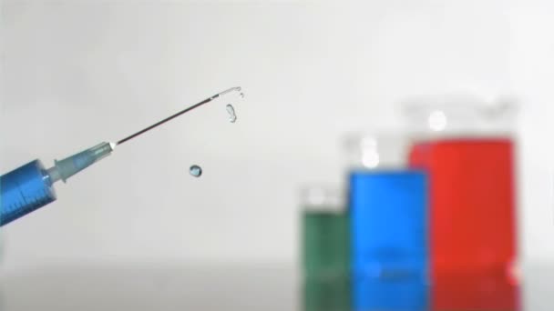 Syringe jet in super slow motion falling in the air — Stock Video