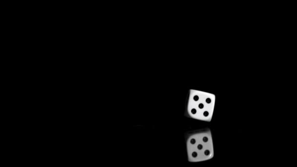 One white dice in a super slow motion even turning on — Stock Video