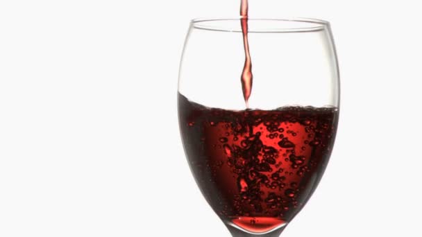 Red trickle in super slow motion flowing in a wineglass — Stock Video