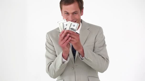 Businessman smelling bank notes — Stock Video