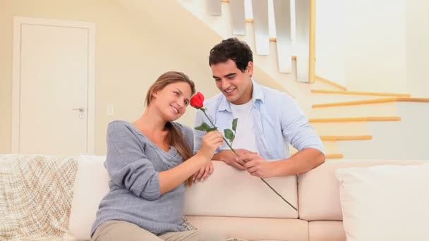 Man offering a rose to his fiancee — Stock Video