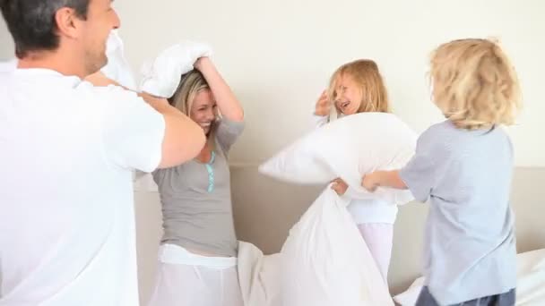 Family having a pillow fight — Stock Video