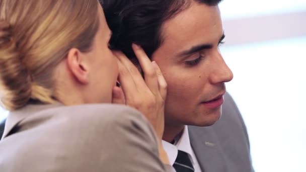 Businesswoman telling a secret to her colleague — Stock Video