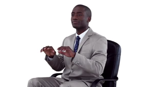 Businessman sitting as he types on a virtual keyboard — Stock Video