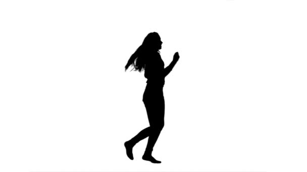 Silhouette of a woman dancing and having fun — Stock Video