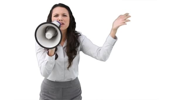 A business woman shouts into a megaphone — Stock Video