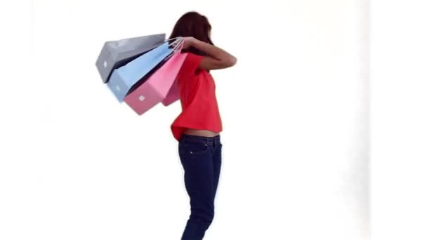 Femme dansant tout en tenant des sacs à provisions — Video