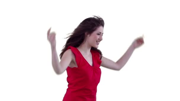 Mulher pulando entusiasticamente enquanto cintilando seu cabelo — Vídeo de Stock