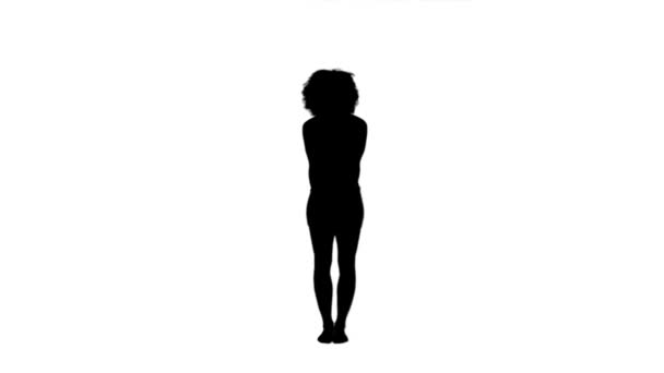 Silhouette d'une femme levant les bras — Video