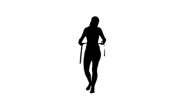 Silhouette woman holding a measuring tape — Stock Video