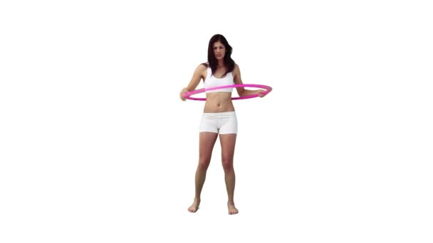 A woman is exercising with a hula hoop — Stock Video