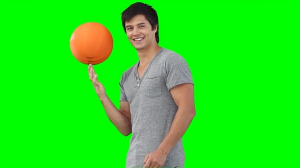 A man spinning a basketball on his hand — Stock Video