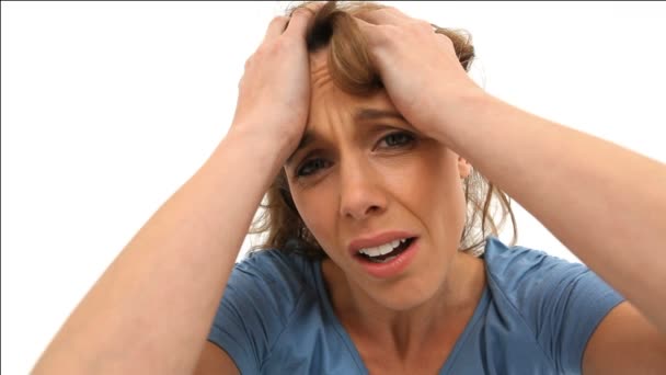 Upset woman placing her hands on her temples — Stock Video