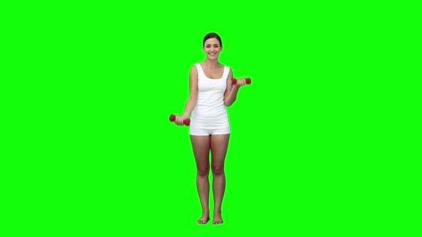Una mujer levanta pesas — Vídeos de Stock