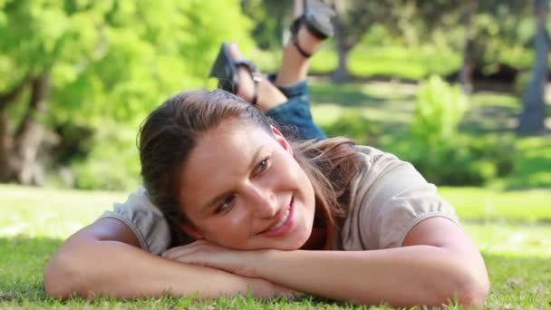 Woman lying on the grass — Stock Video